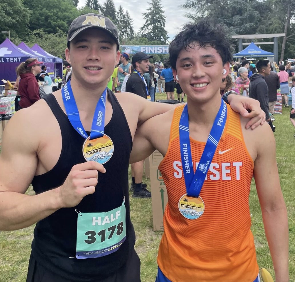 two finishers with medals at the seattle half